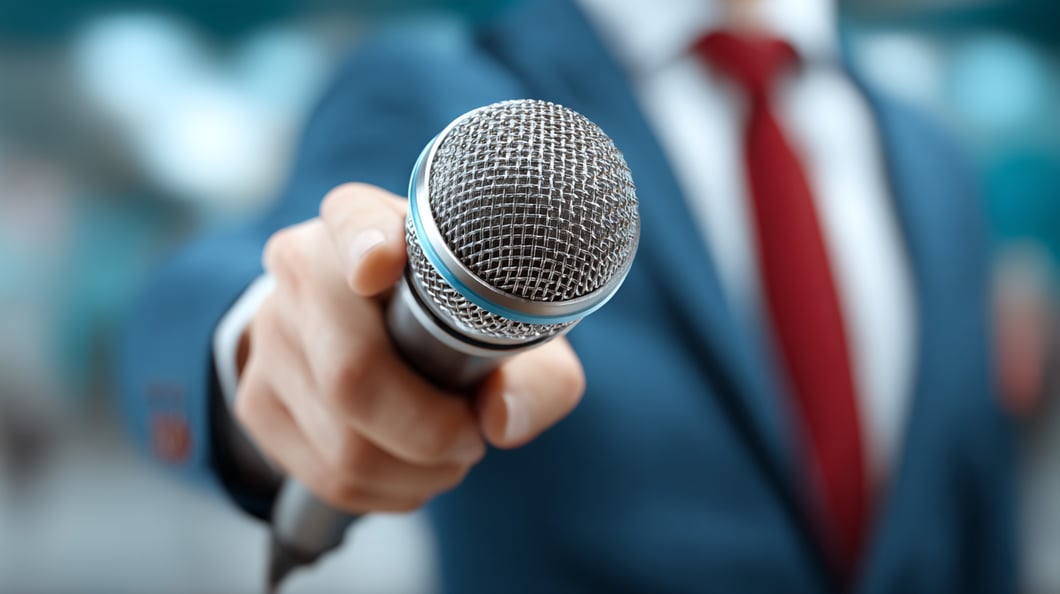 Healthcare health tech biotech life sciences reporter holding microphone 