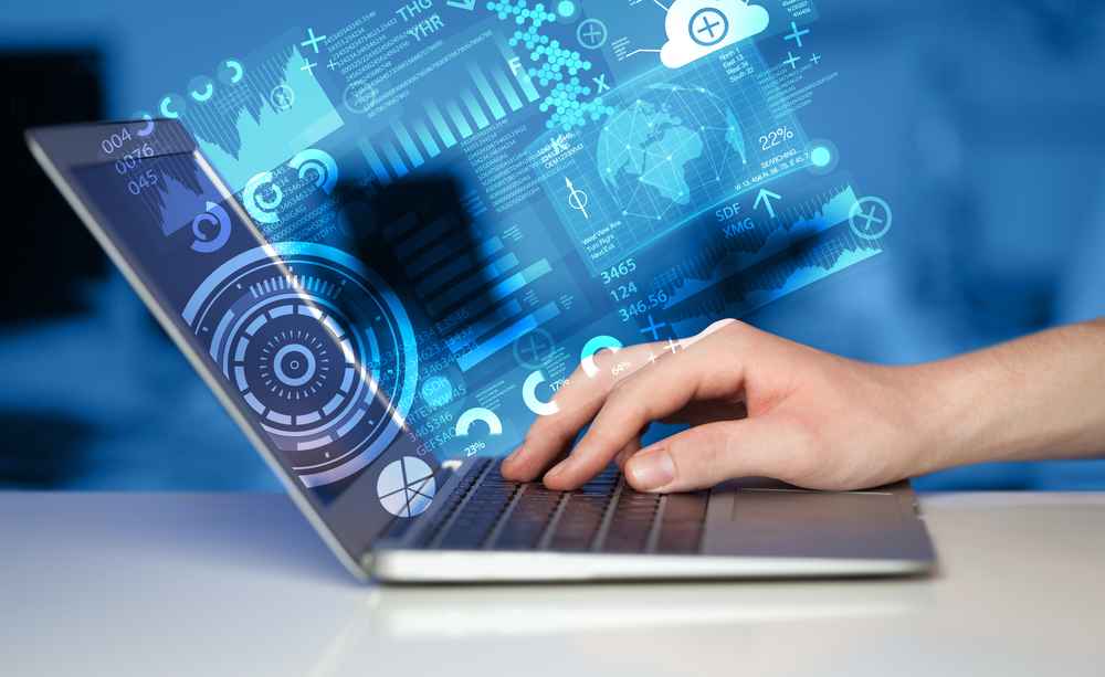 Modern notebook computer with future technology media symbols 