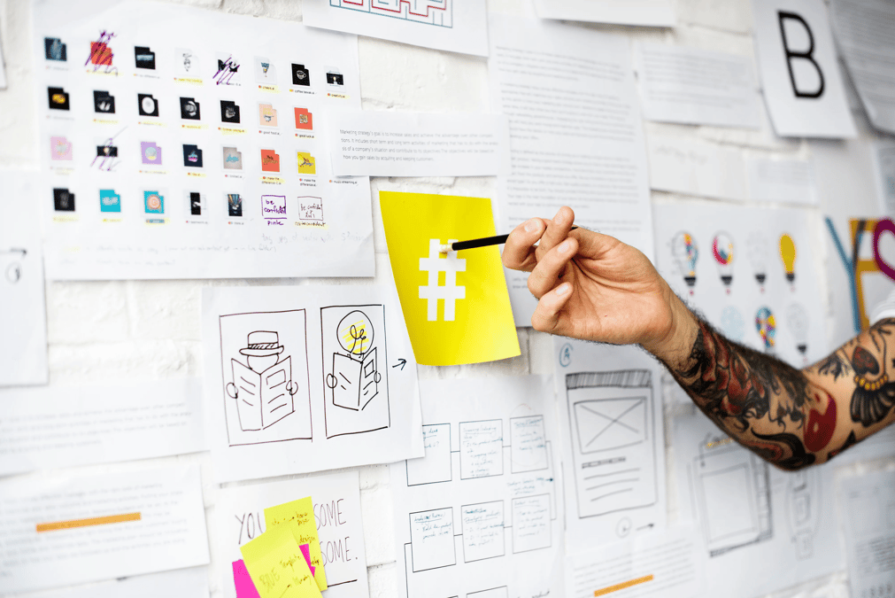 tattoo-hand-pointing-on-hashtag-sign-on-yellow-PB8TYRZ 