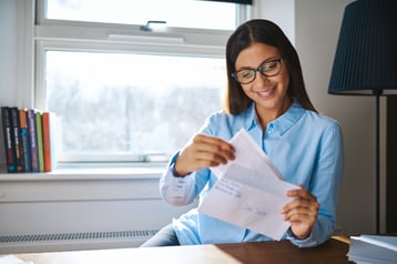 young-business-entrepreneur-checking-her-mail-WXMJ2ZN