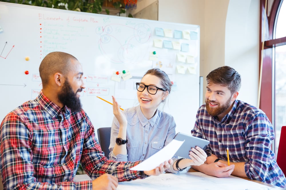 Multiethnic group of happy business people working together in the office. 
