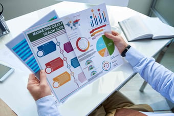  Marketer looking at colorful graphics 