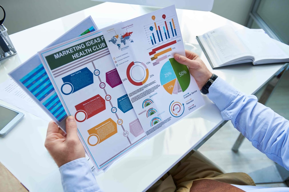 Marketer looking at colorful graphics 